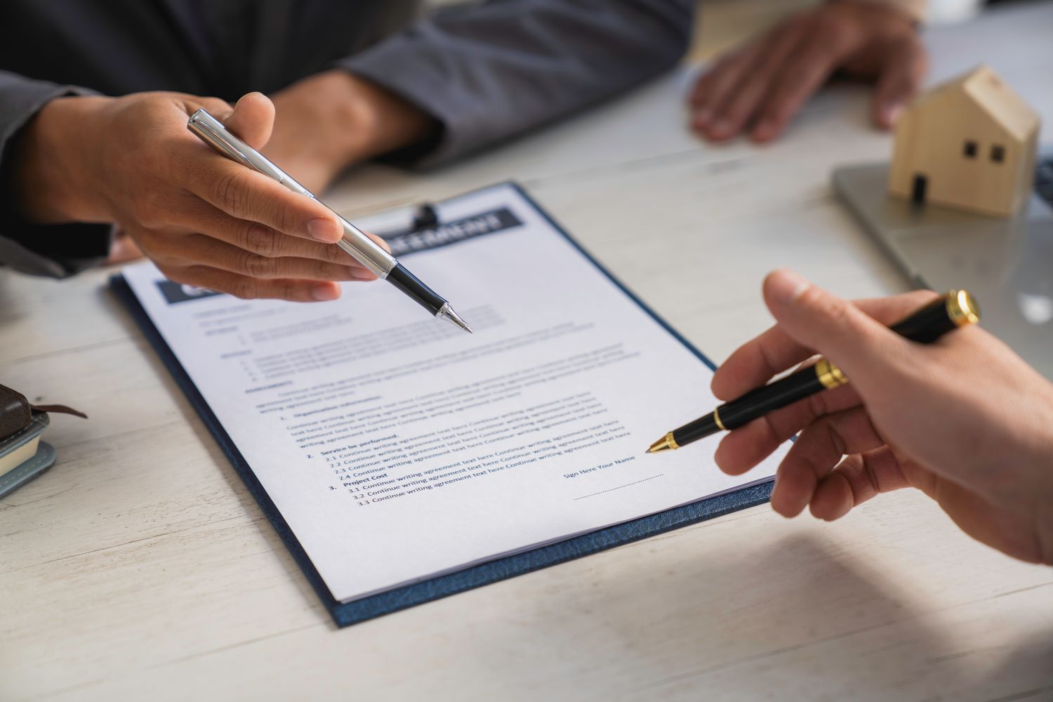 People signing contract