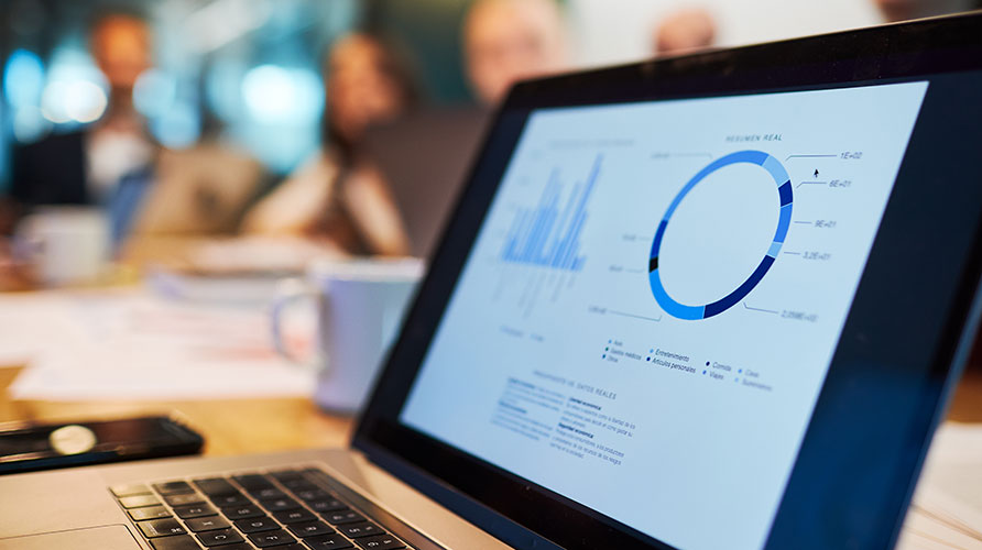 laptop screen showing graphs