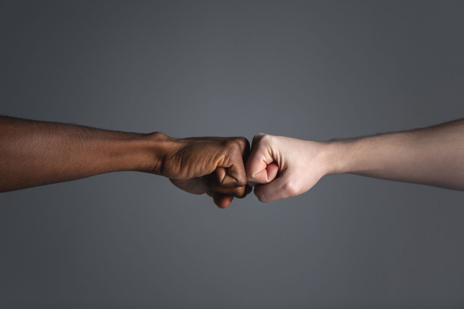 hands fist bumping