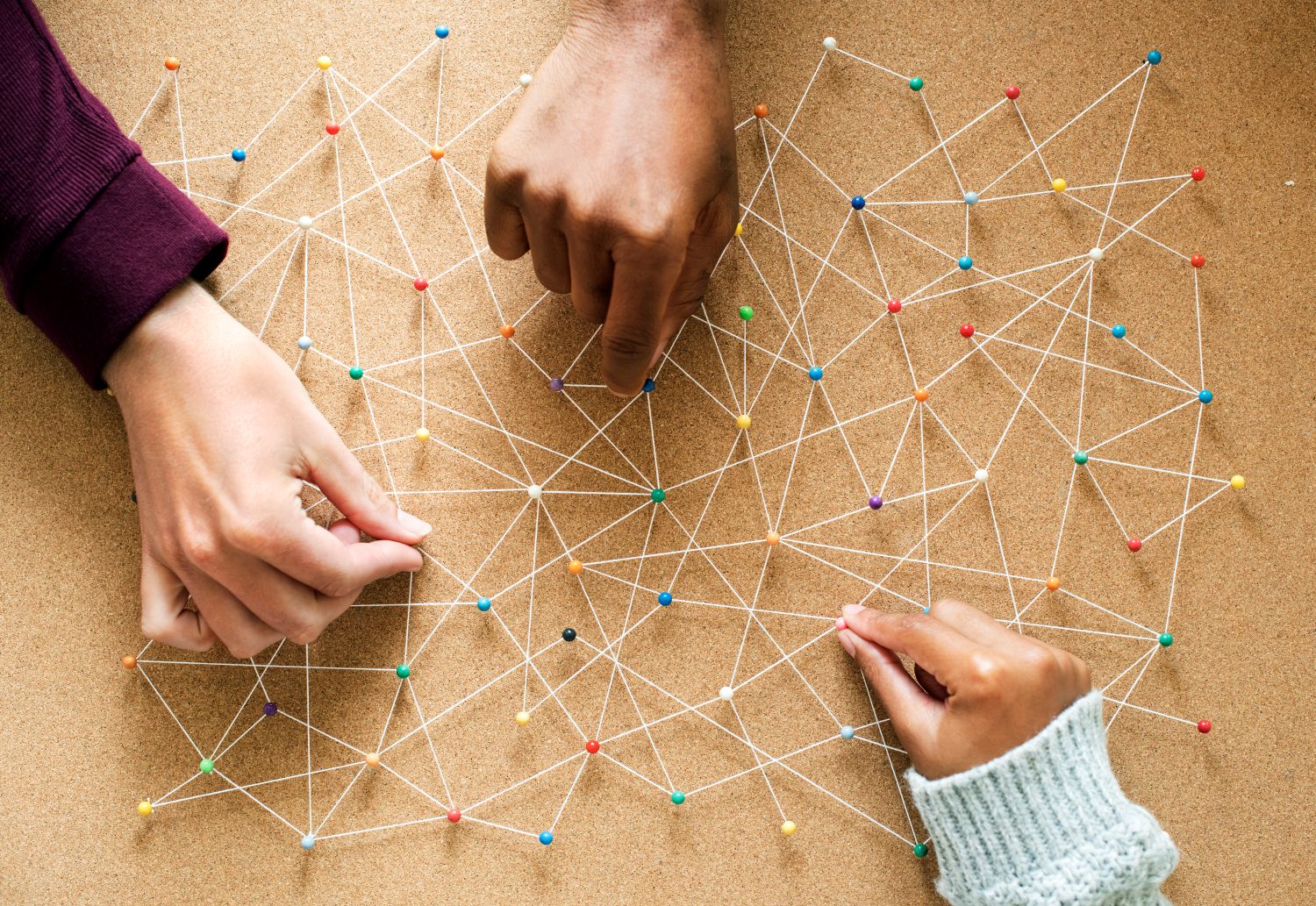 Hands working together on a design