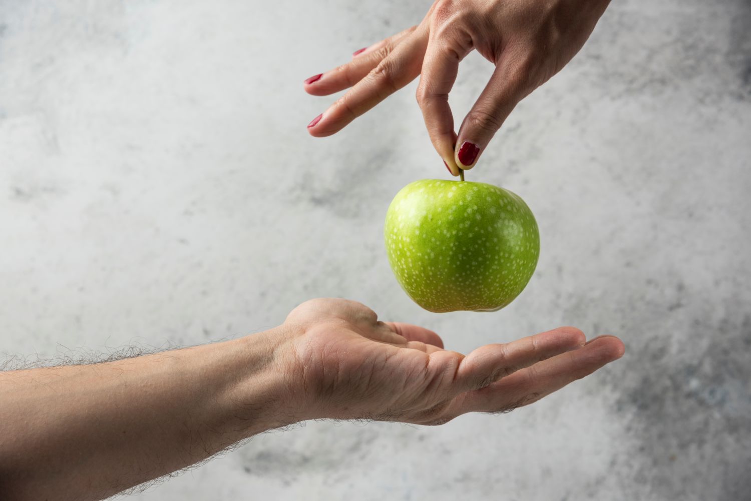 hands and apple